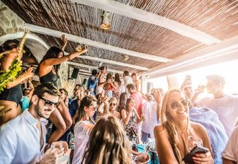 daytime party in the bar at Nammos beach club on Mykonos, Greece