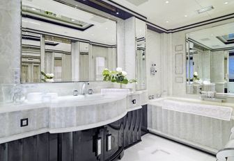 onyx-clad en-suite bathroom in master suite aboard charter yacht ‘Silver Angel’