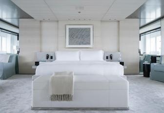 tranquil master suite with pops of pale blue on board motor yacht Grace E