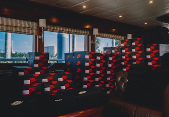 shoe boxes of Air Jordan 1 Retro High OG trainers in the main salon of charter yacht Julia Dorothy 