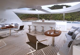 seating areas and bar on the sundeck of motor yacht Orient Star