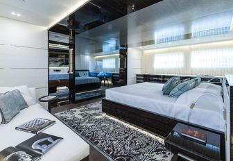 master suite with bed and sofa on board motor yacht ENTOURAGE 