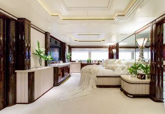 the master's stateroom on charter yacht lioness v with full beam windows and large bed adn flat screen tv