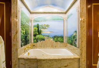 Tahitian mural above the bath in en-suite bathroom aboard luxury yacht My Seanna