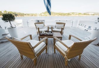 table and chairs on the aft deck of motor yacht OASIS