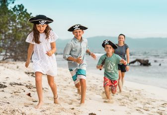 kids dressed up as pirates look for treasure