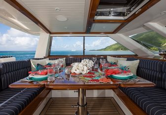 pilothouse cockpit is set up for dinner on board luxury yacht MARAE