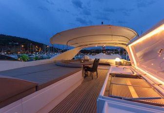 luxury charter yacht zambezi's upper deck in the evening looking out to Greek town