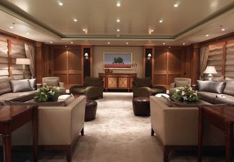 sophisticated main salon with comfortable seating areas on board luxury yacht UTOPIA