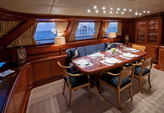 formal dining area on the upper level of the main salon aboard charter yacht HYPERION