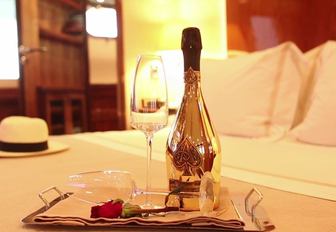 A bottle of champagne delivered to a stateroom on board a luxury yacht