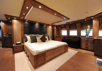 bed and oak lime in master suite of luxury yacht vantage