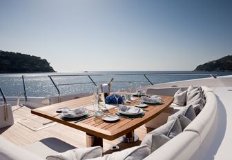 foredeck seating area set up for lunch on board motor yacht THUMPER