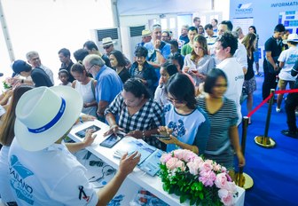 visitors sign into the Thailand Yacht Show in Ao Po Grand Marina, Phuket