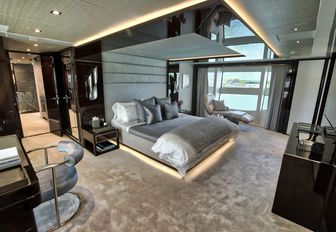 master suite with dark wooden furniture and light colour palette on board charter yacht Take 5
