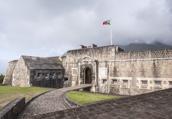 Old fortress against grey cloud sky in St Kitts, Caribbean