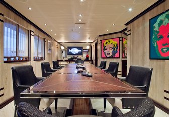 large dining table on board charter yacht ‘Force Blue’ with Marilyn Monroe pop art