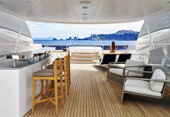 bar and sumptuous arm chairs under the radar arch on the sundeck of luxury yacht ASYA 