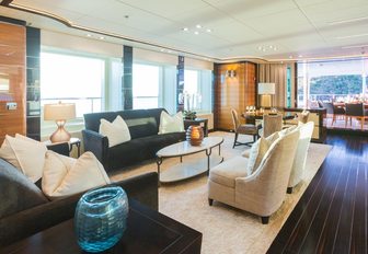 upper salon flanked by huge windows on board charter yacht Party Girl