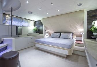 Master cabin on board superyacht One Blue, with white and cream colour palette