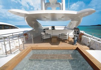 spa pool with seating beyond on board motor yacht Infinity Pacific