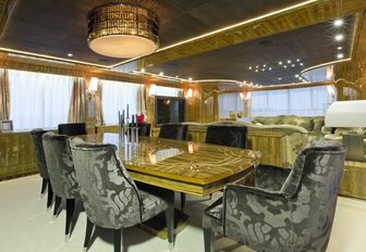 custom made dining table with inlaid floral pattern on board charter yacht OKKO 