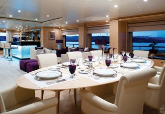 lime wood dining table in main salon of motor yacht ‘Step One’ 