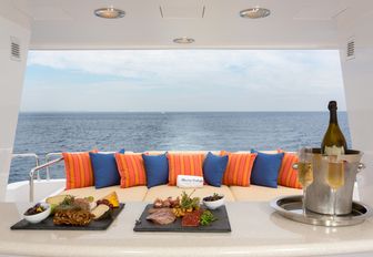 champagne and platters line up on board deck of motor yacht 'Chasing Daylight'