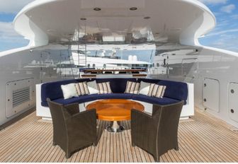 sundeck seating area with sofa and armchairs on board luxury yacht Sequel P