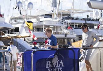 attendee steps off a yacht after a viewing at the Antigua Charter Yacht Show