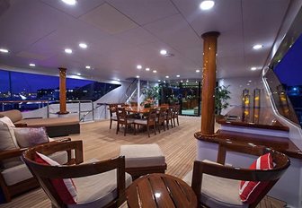 Alfresco dining and lounging area on board deck of luxury yacht Aspen Alternative