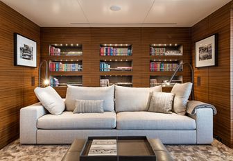media salon with comfortable sofa and shelves aboard motor yacht ‘Silver Fast’ 