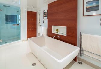 ensuite bathroom with shower and bath tub on board luxury yacht Big Sky 