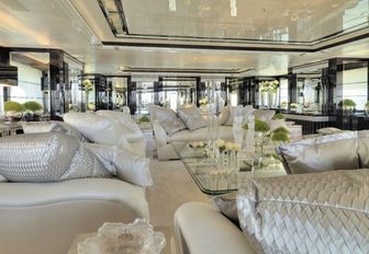 Silver angel main salon lounging area with white sofas and furnishings