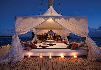 bedouin tent on deck of sailing yacht TIARA as sun sets