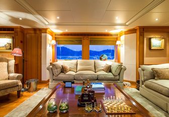 sumptuous lounge with low coffee table aboard charter yacht ‘Seven Sins’ 