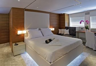 VIP cabin on board luxury yacht Tropicana with white linen and champagne