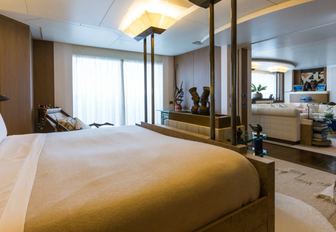 master suite with Polynesian-inspired decor on board luxury yacht Coral Ocean