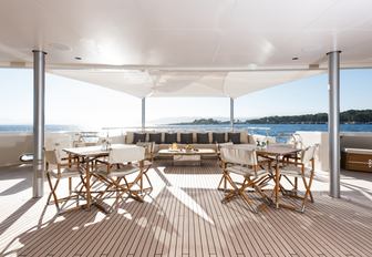 spacious deck area with lounging option aboard charter yacht RoMEA 