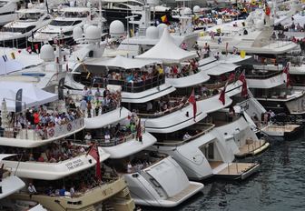spectators take in the Monaco Grand Prix from superyachts