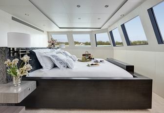 clean and contemporary master suite with iconic windows on board motor yacht HIGHLANDER