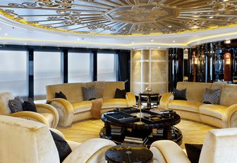 salon with circular seating arrangement on board motor yacht Phoenix 2