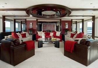 lounge area with sumptuous sofas in the main salon of superyacht SLIPSTREAM