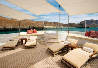 The Jacuzzi and sunloungers situated on the sundeck of motor yacht WILDFLOUR