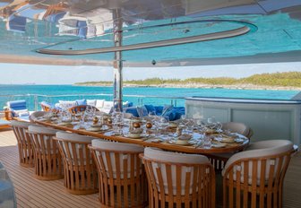 long oval dining table on the upper deck aft of luxury yacht ‘My Seanna’ 