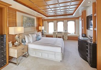 full-beam master suite with oak paneling on board charter yacht HANIKON 