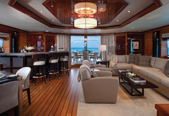 inviting skylounge with sofa, games table and bar on board charter yacht IMPROMPTU 