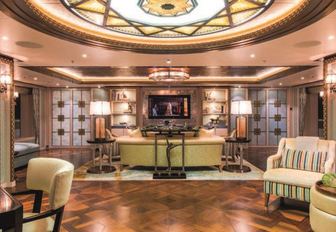 Owner salon with gold furnishings on board motor yacht Solandge