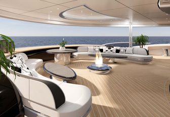 A firepit on the aft deck onboard superyacht KISMET, surrounded by white seating