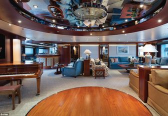 piano and seating areas in the main salon aboard superyacht ‘Lauren L’ 